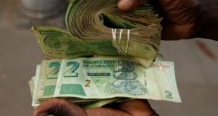 Zimbabwe suspends bank lending in bid to arrest currency decline