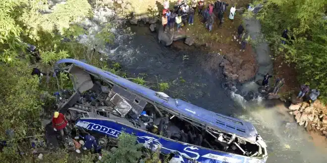 Passengers rescued after floodwaters swept a bus off a bridge