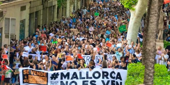 Residents of a Spanish town demonstrate against excesses of tourism